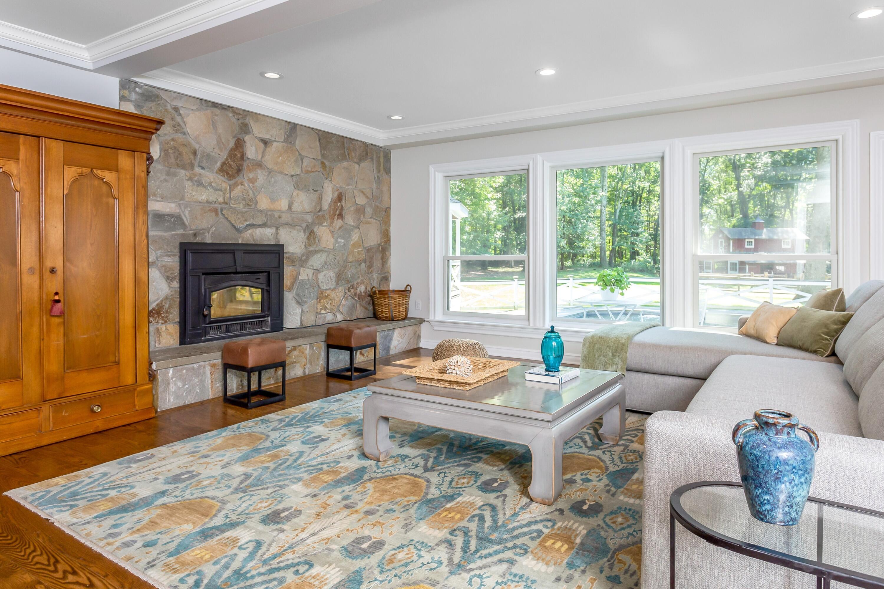 30 Carrington Drive Greenwich, CT 06831 - Photo 7 of 46 a living room with furniture and a fireplace