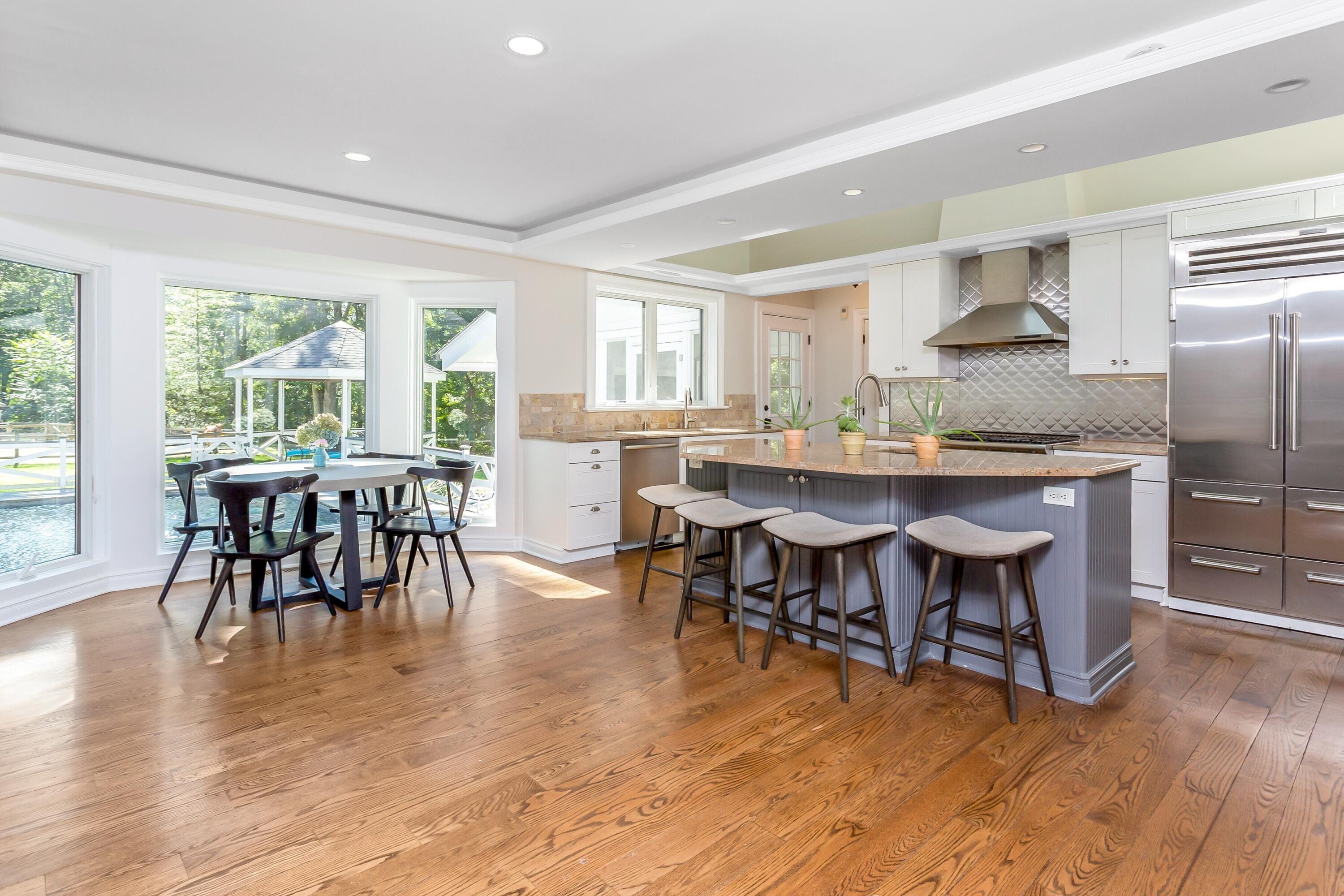 30 Carrington Drive Greenwich, CT 06831 - Photo 9 of 46 a view of a a dining room with furniture window and wooden floor