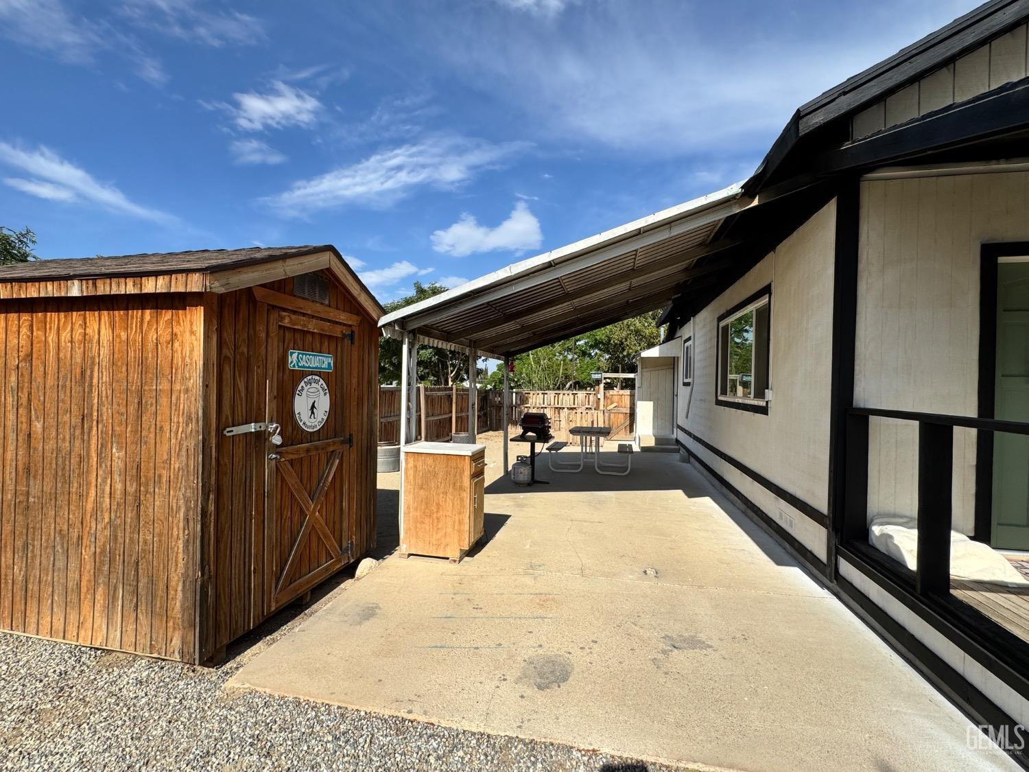 Undisclosed Address Maricopa, CA 93252 - Photo 12 of 33 a view of a house with wooden walls and floor to ceiling window