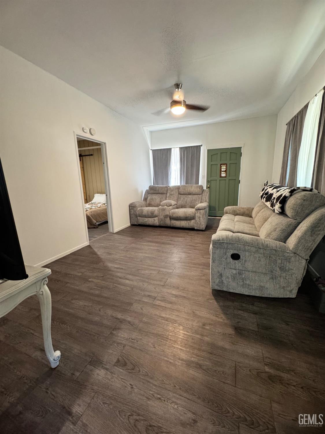Undisclosed Address Maricopa, CA 93252 - Photo 15 of 33 a living room with furniture and a chandelier
