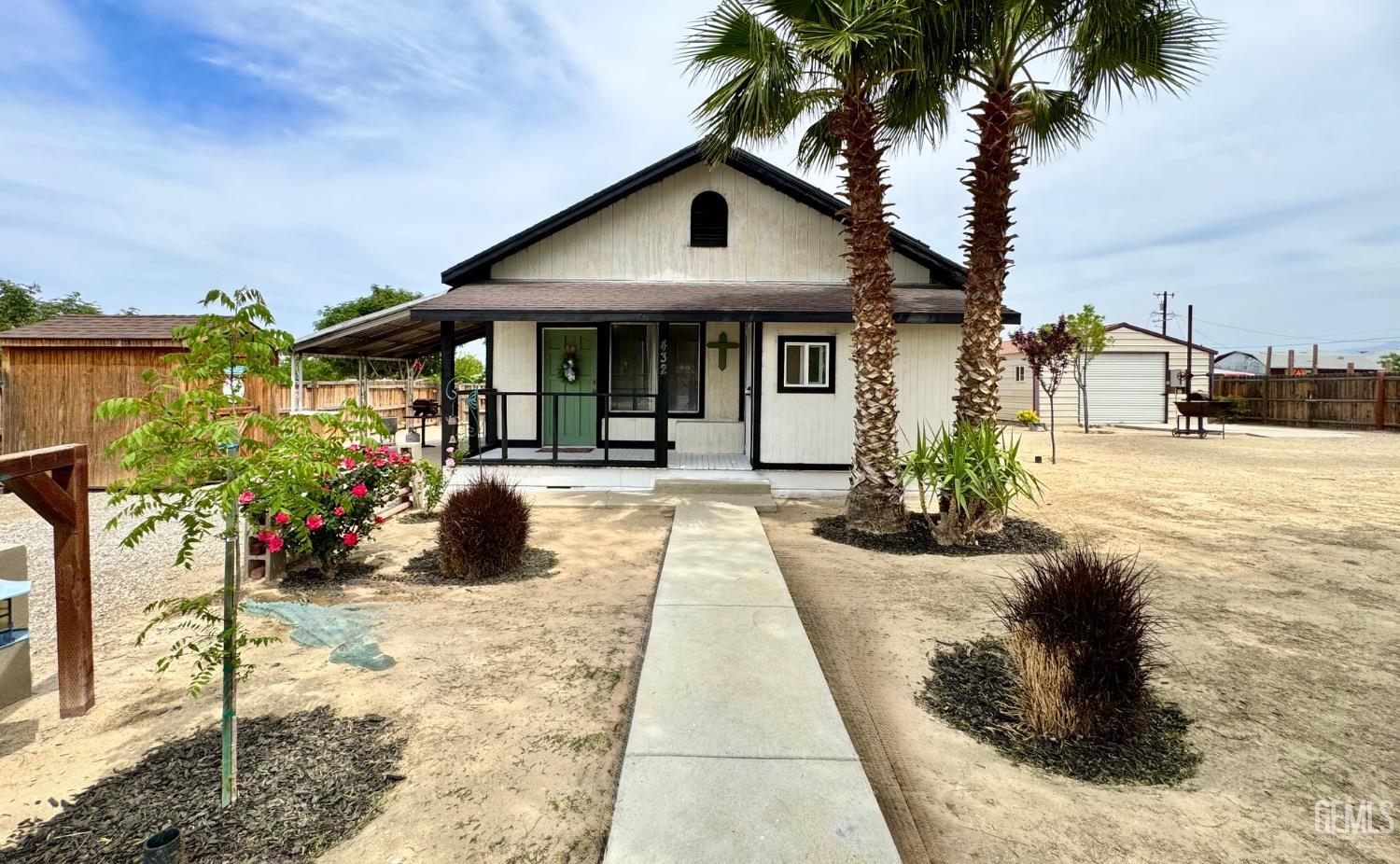 Undisclosed Address Maricopa, CA 93252 - Photo 5 of 33 a front view of a house with a porch