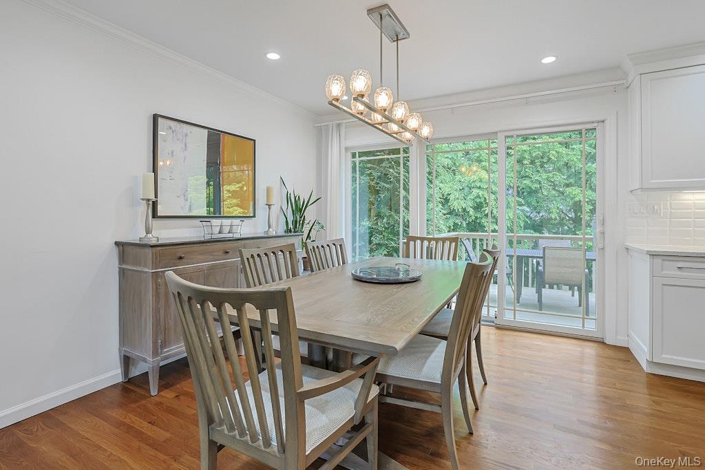 305 Stratton Road New Rochelle, NY 10804 - Photo 9 of 32 a view of a dining room with furniture window and wooden floor