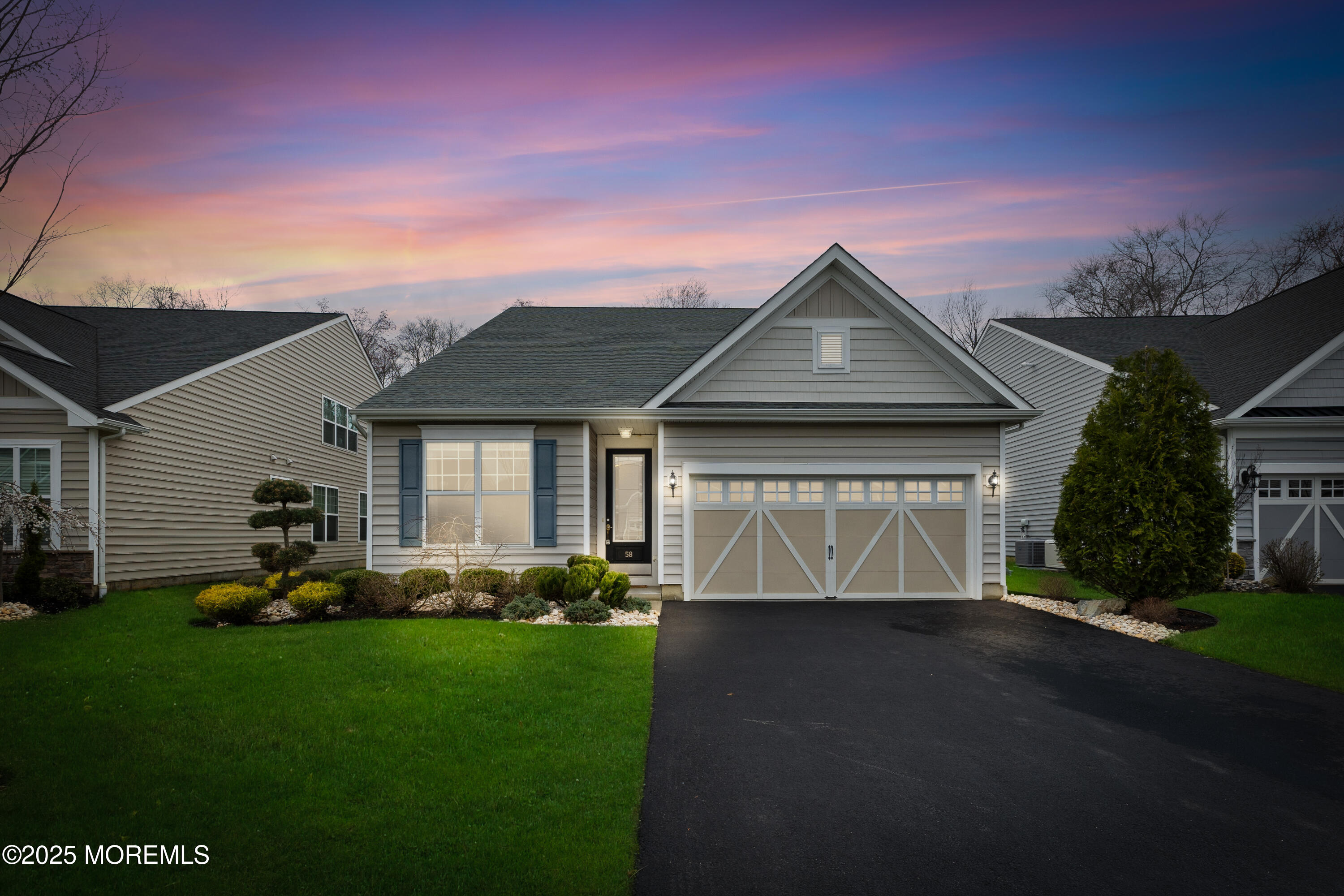58 Harvest Ridge Road Howell, NJ 07731 - Photo 1 of 53 a front view of a house with a garden and yard