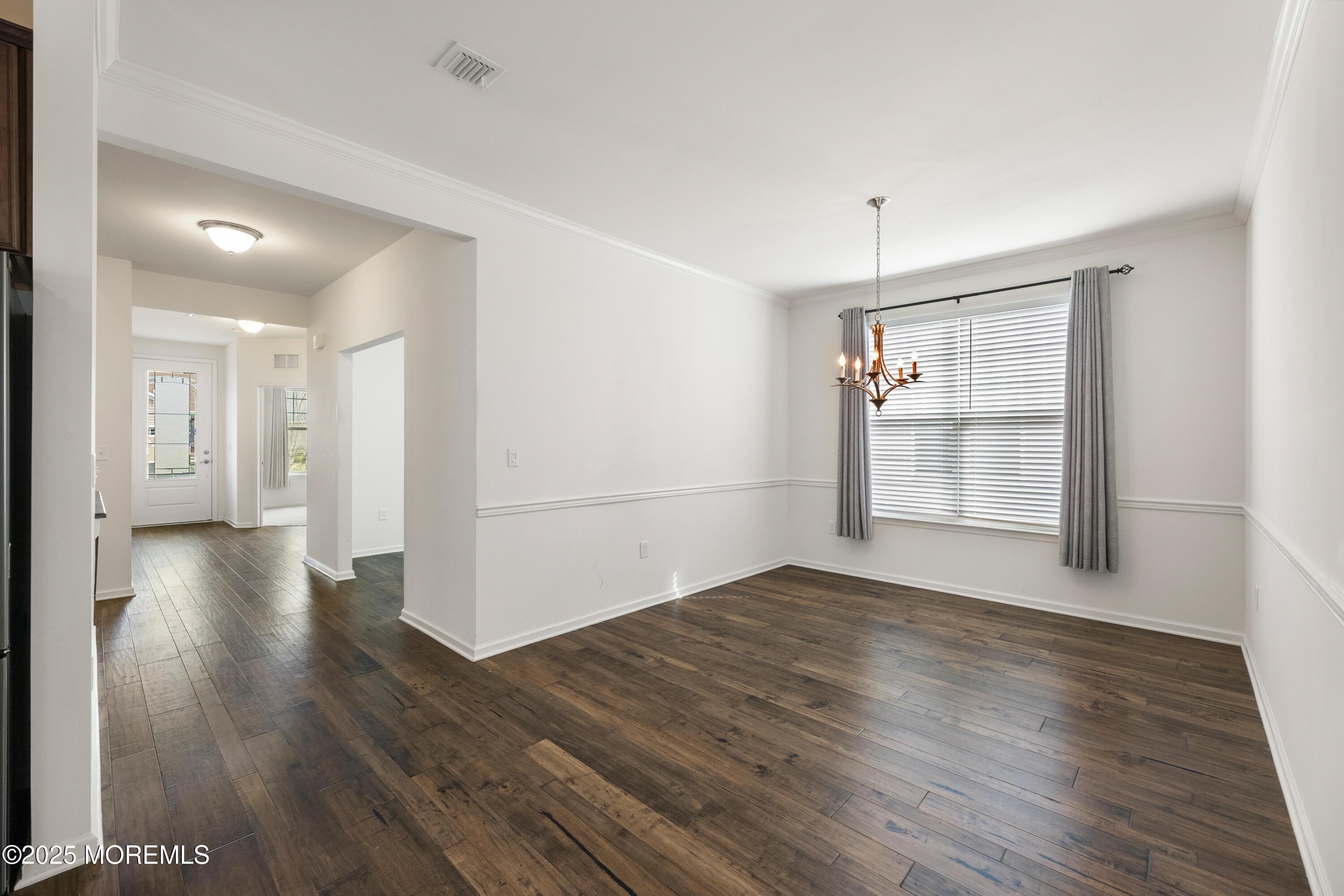 58 Harvest Ridge Road Howell, NJ 07731 - Photo 11 of 53 an empty room with wooden floor and windows