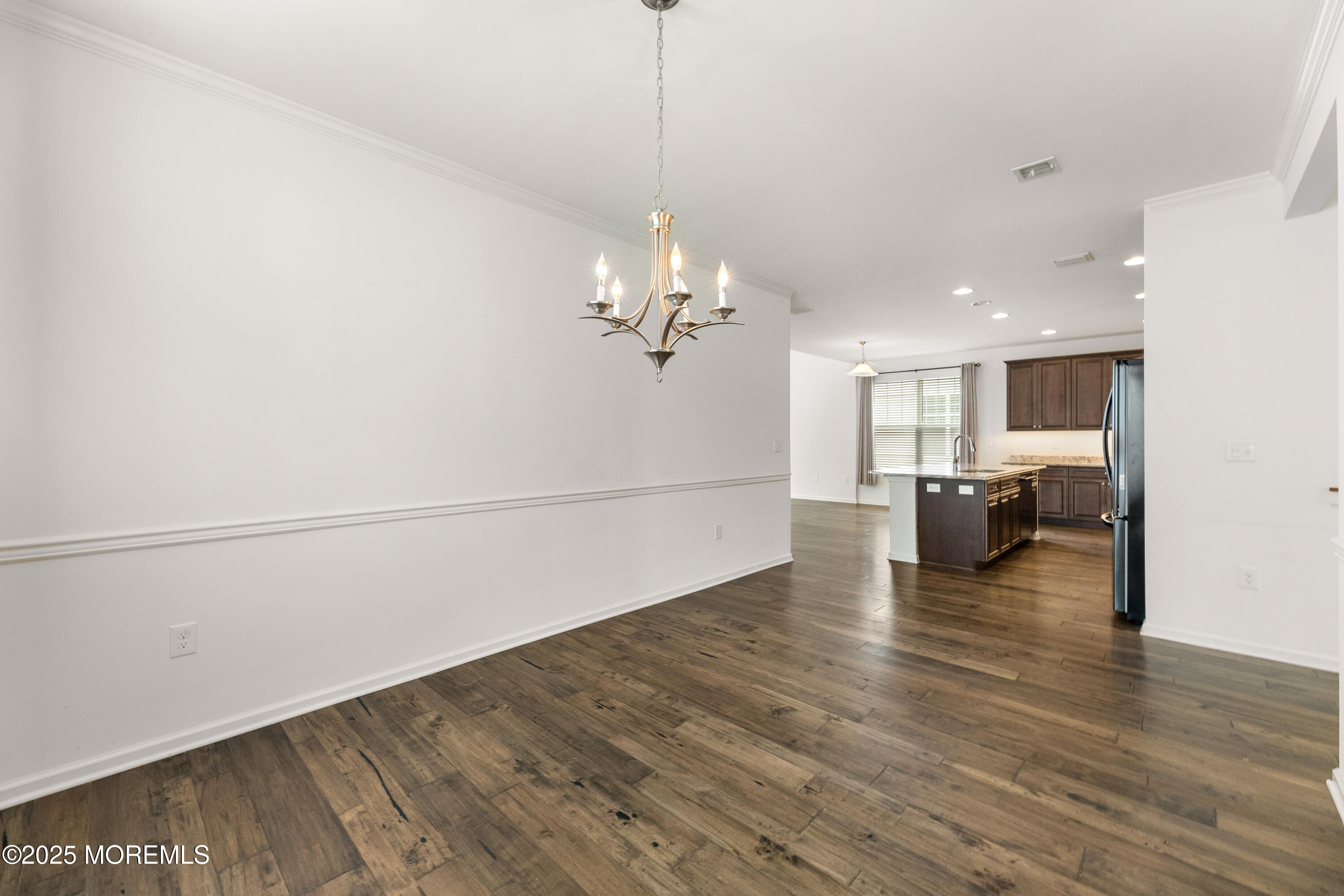 58 Harvest Ridge Road Howell, NJ 07731 - Photo 13 of 53 a living room with couches and kitchen view with wooden floor