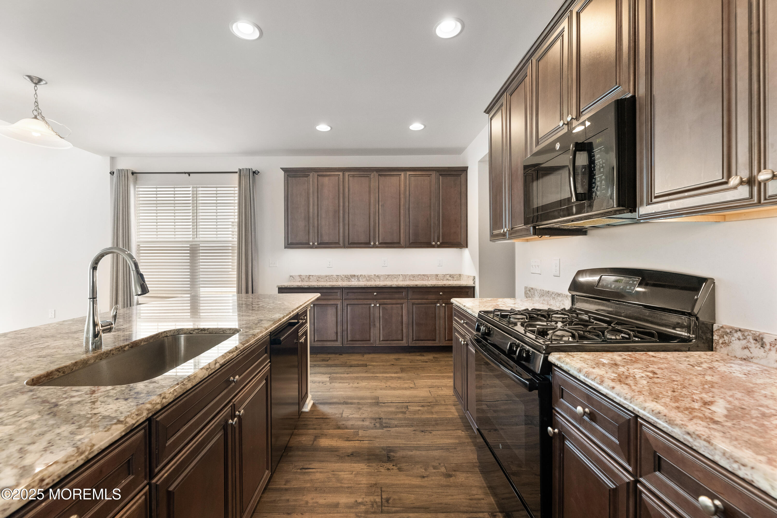 58 Harvest Ridge Road Howell, NJ 07731 - Photo 17 of 53 a kitchen with stainless steel appliances granite countertop a sink stove and cabinets