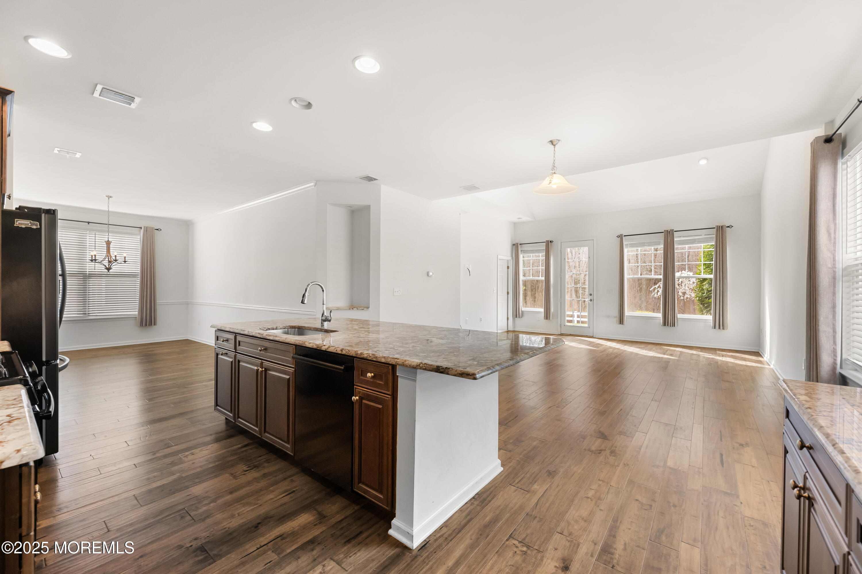 58 Harvest Ridge Road Howell, NJ 07731 - Photo 19 of 53 a large kitchen with stainless steel appliances granite countertop a lot of counter space and wooden floors