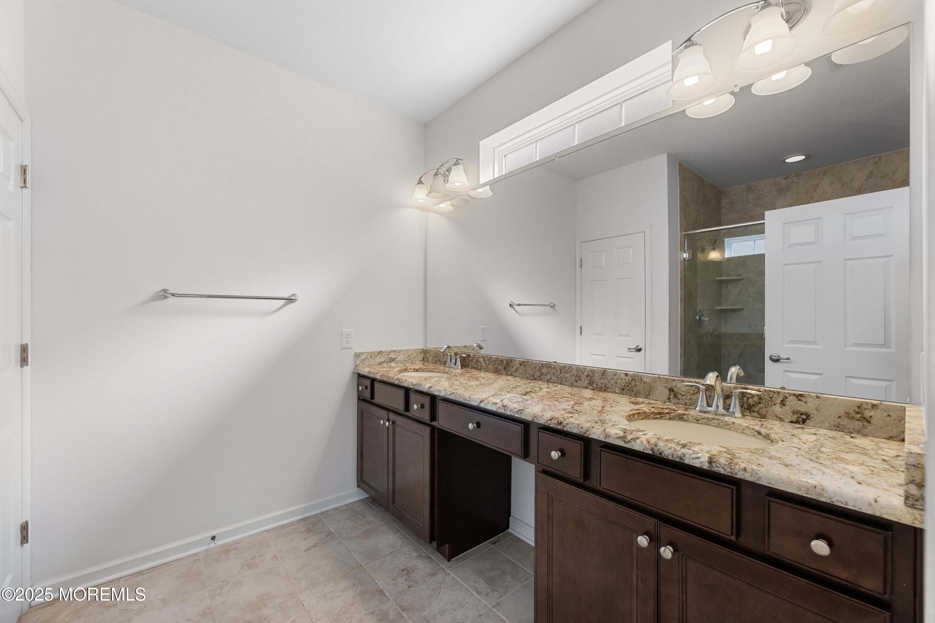58 Harvest Ridge Road Howell, NJ 07731 - Photo 26 of 53 a bathroom with a granite countertop sink a large mirror and a shower