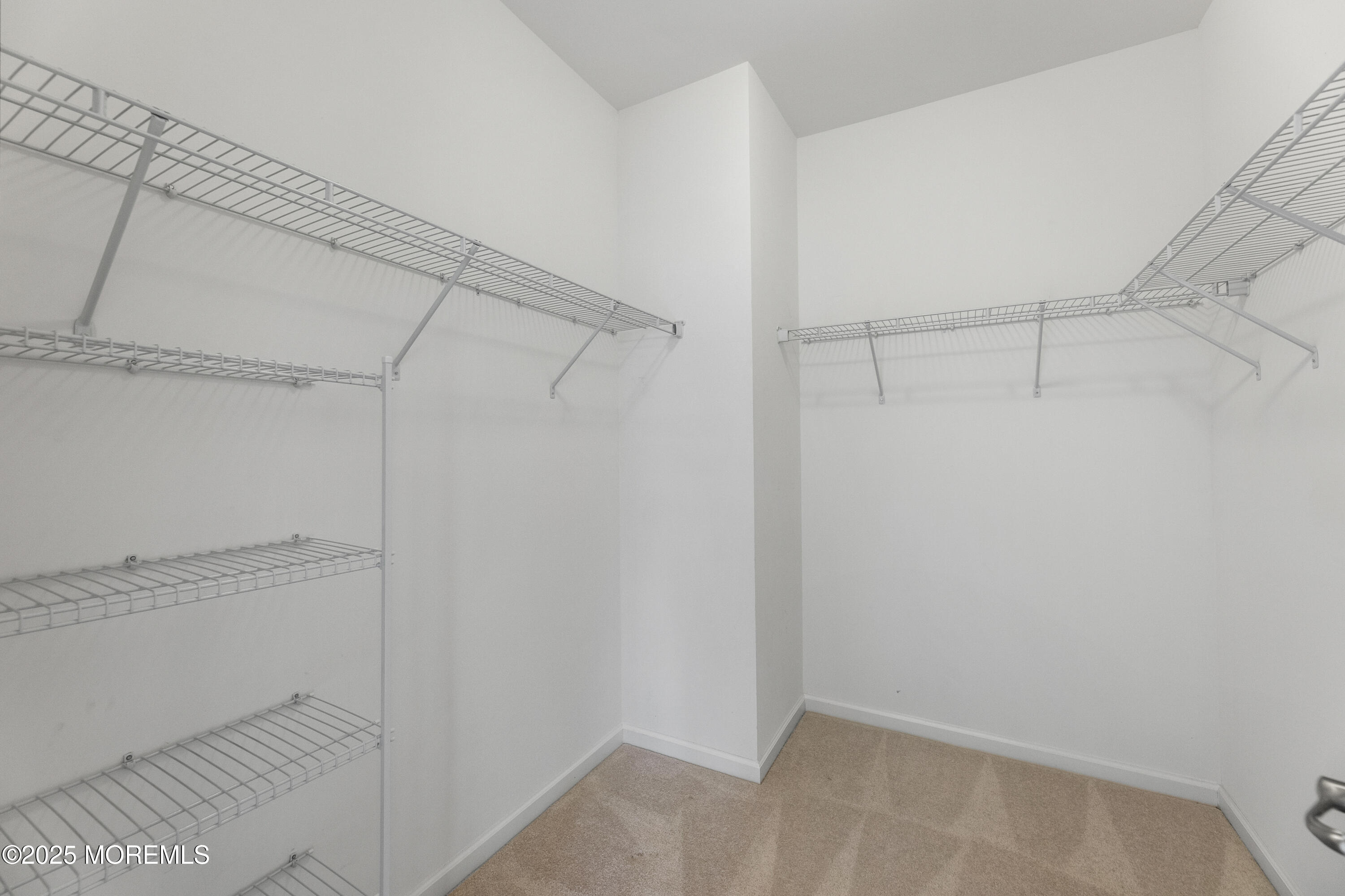 58 Harvest Ridge Road Howell, NJ 07731 - Photo 27 of 53 a view of a room with racks on the wall