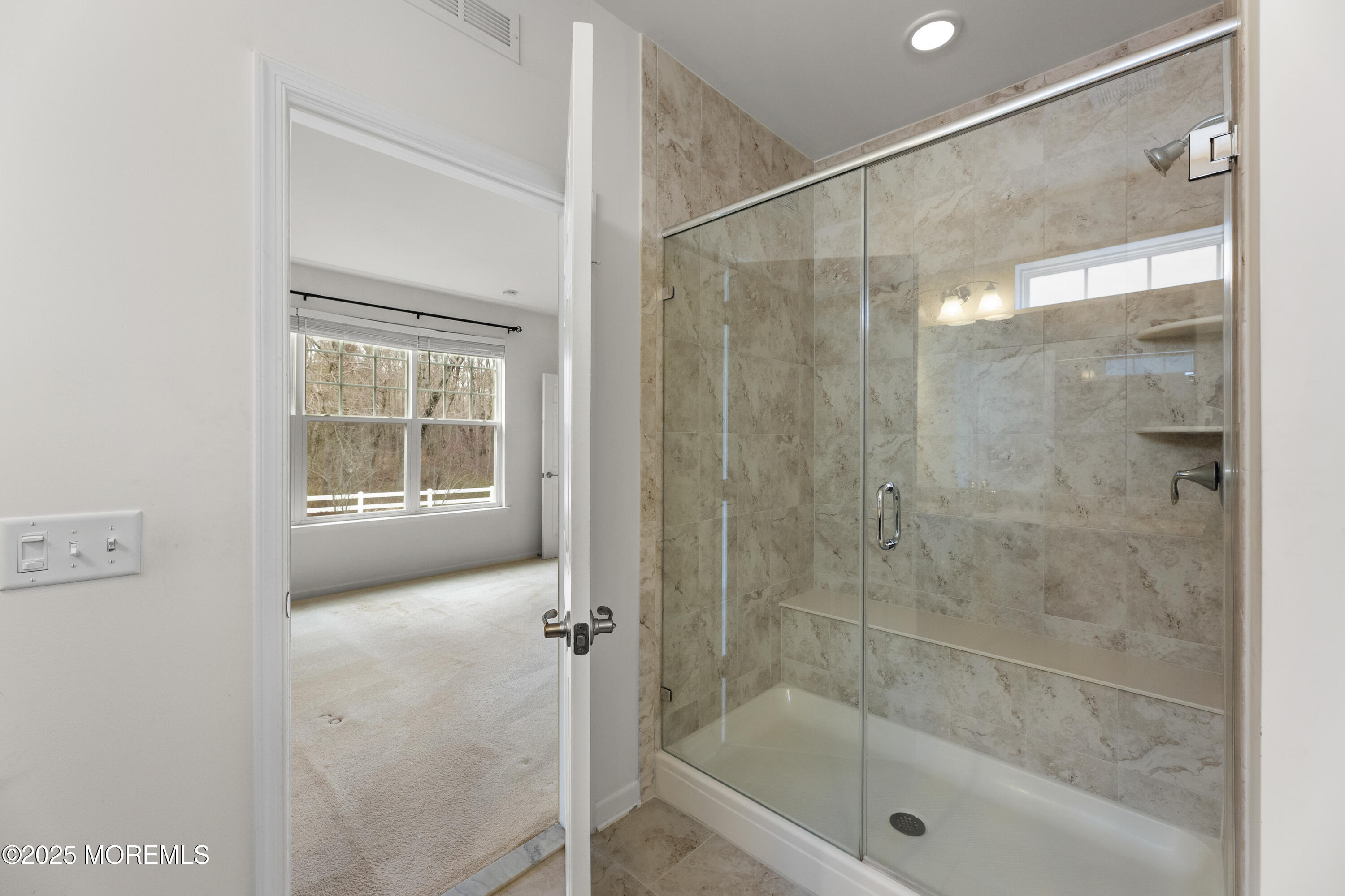 58 Harvest Ridge Road Howell, NJ 07731 - Photo 28 of 53 a bathroom with a glass shower door