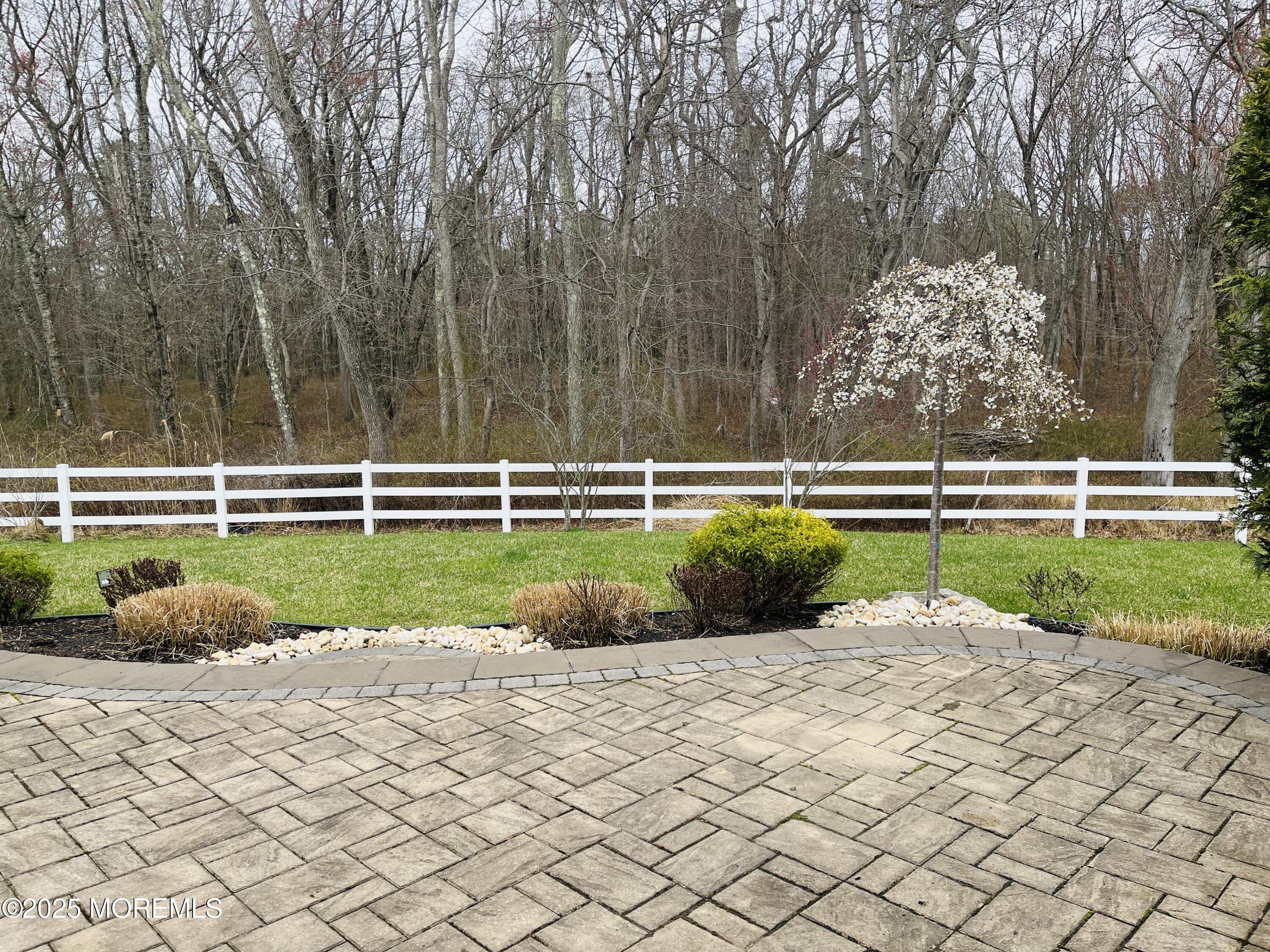 58 Harvest Ridge Road Howell, NJ 07731 - Photo 36 of 53 a view of a lake with a yard