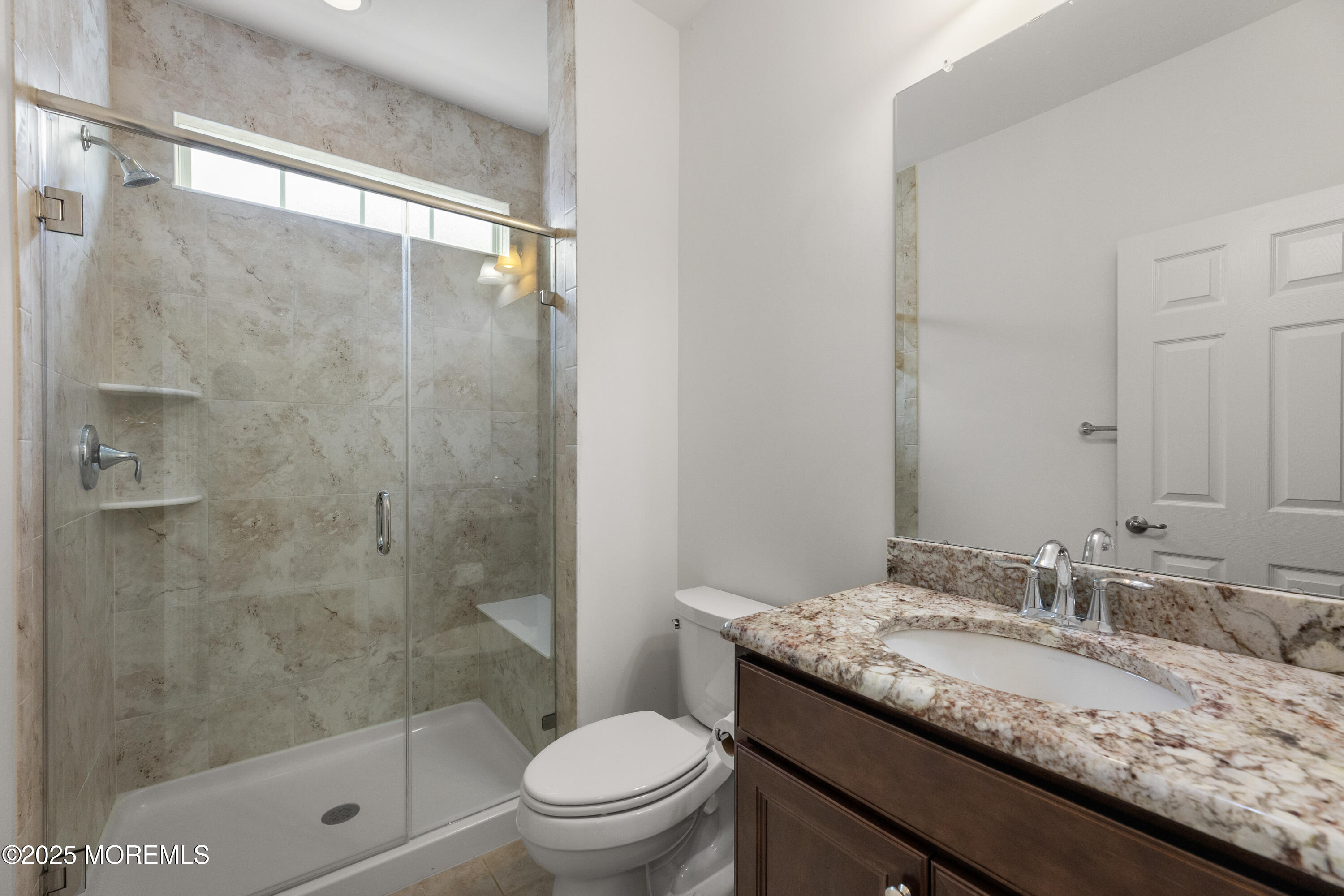 58 Harvest Ridge Road Howell, NJ 07731 - Photo 8 of 53 a bathroom with a granite countertop sink a toilet and shower