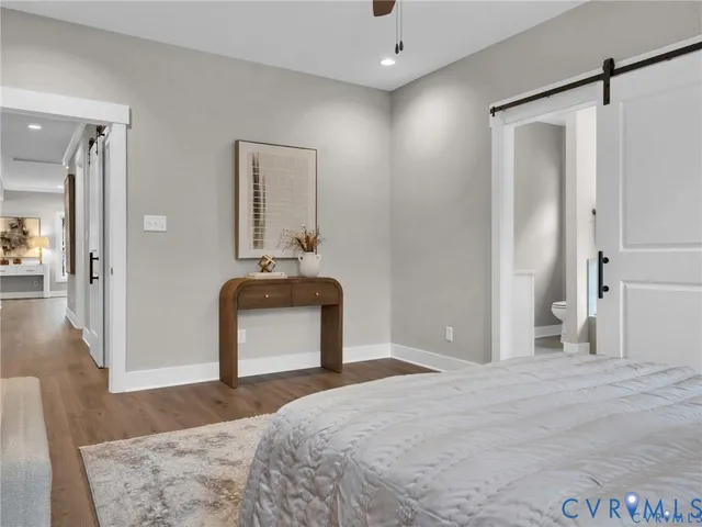 a bedroom with a bed and a mirror