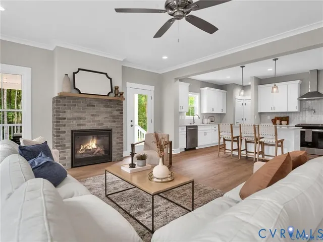 a living room with furniture and a fireplace