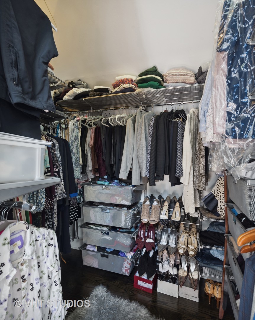 1750 West School Street Chicago, IL 60657 - Photo 14 of 37 a view of walk in closet with clothes and shoes