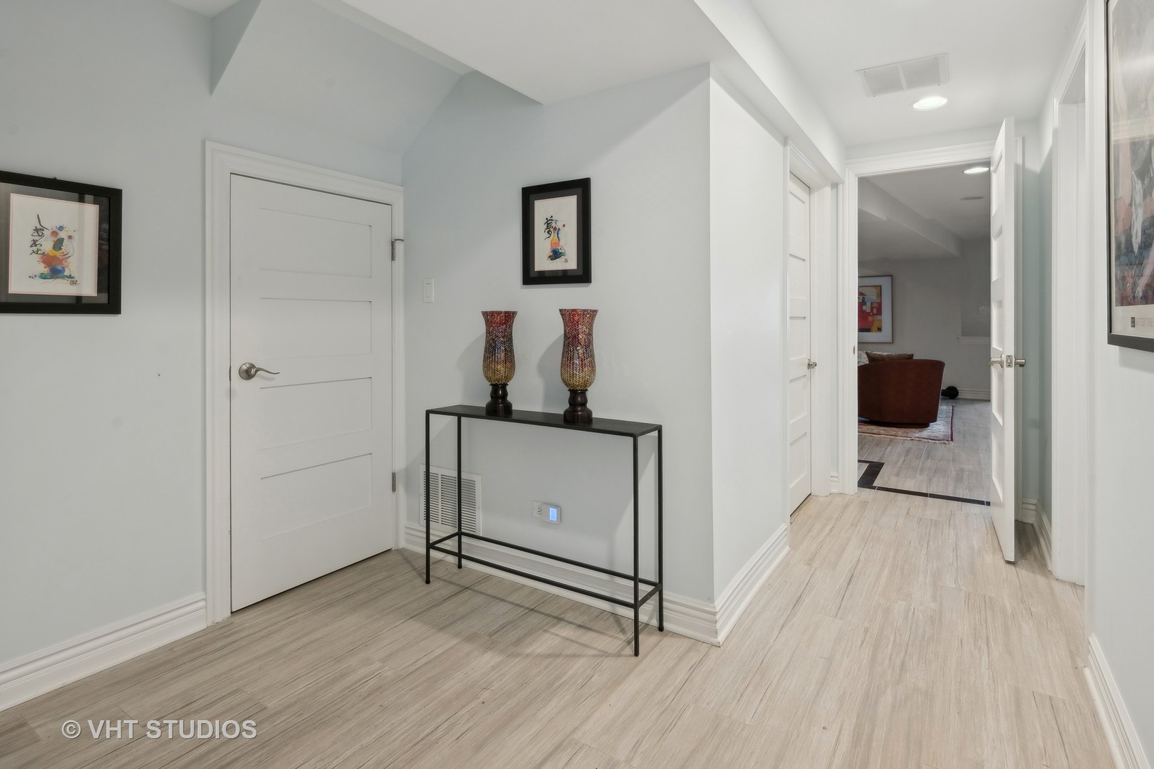 1750 West School Street Chicago, IL 60657 - Photo 25 of 37 a view of a room with wooden floor and white walls