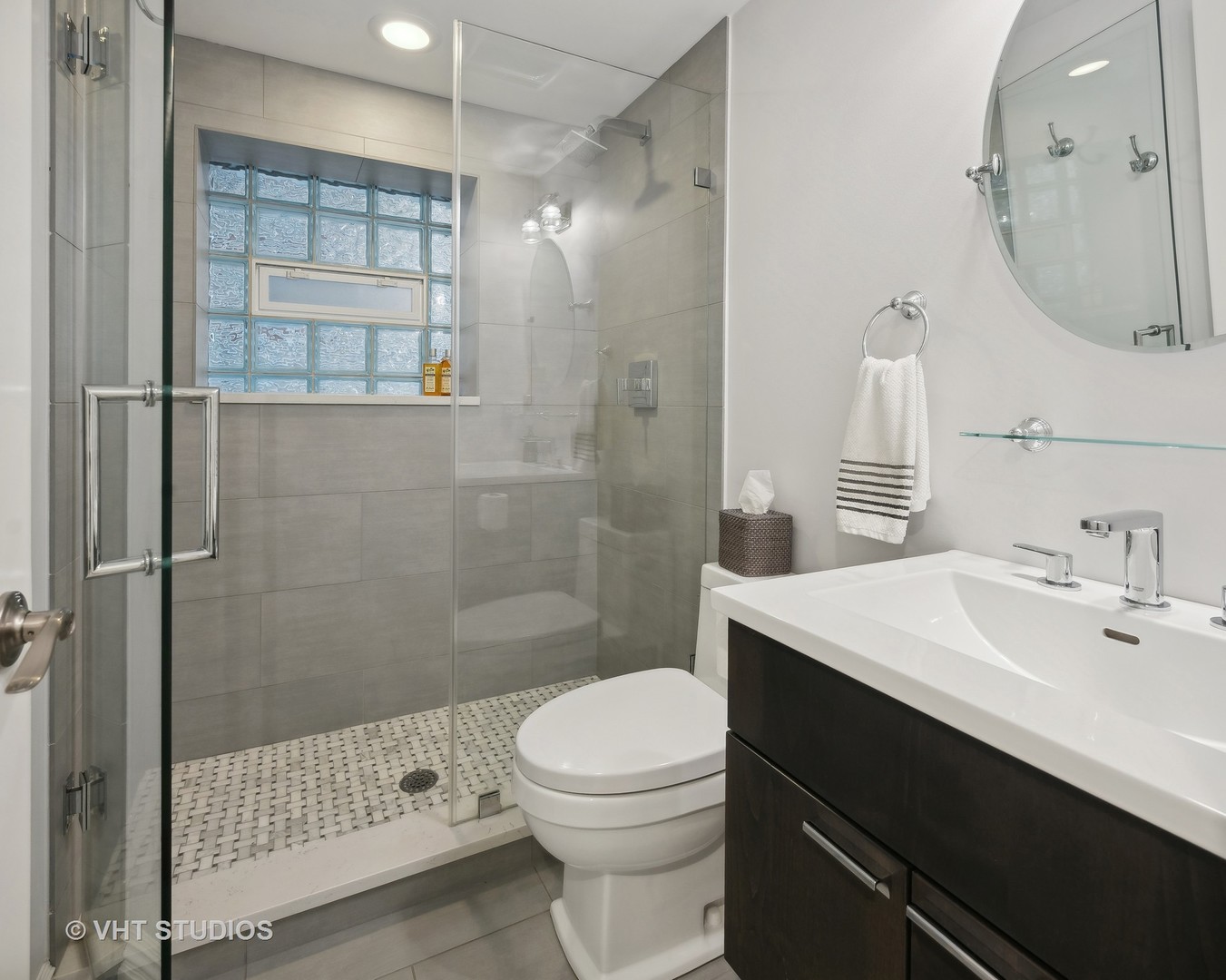 1750 West School Street Chicago, IL 60657 - Photo 26 of 37 a bathroom with a sink a toilet and shower