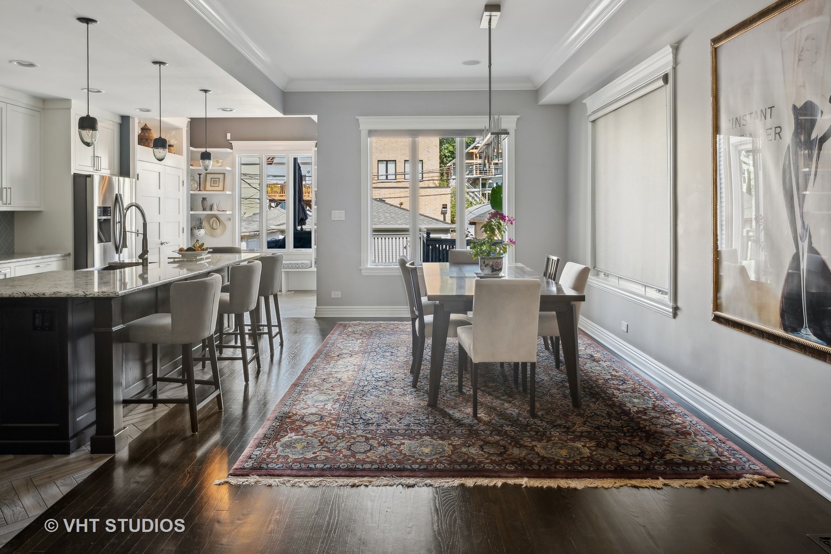 1750 West School Street Chicago, IL 60657 - Photo 3 of 37 a dining room with furniture a chandelier and wooden floor