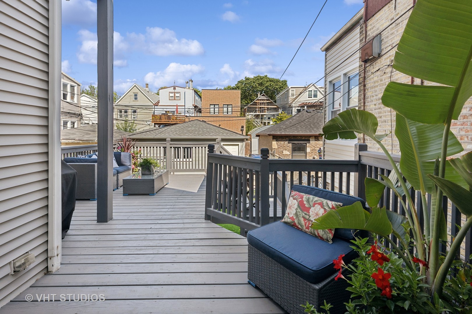 1750 West School Street Chicago, IL 60657 - Photo 7 of 37 a balcony with lots of potted plants