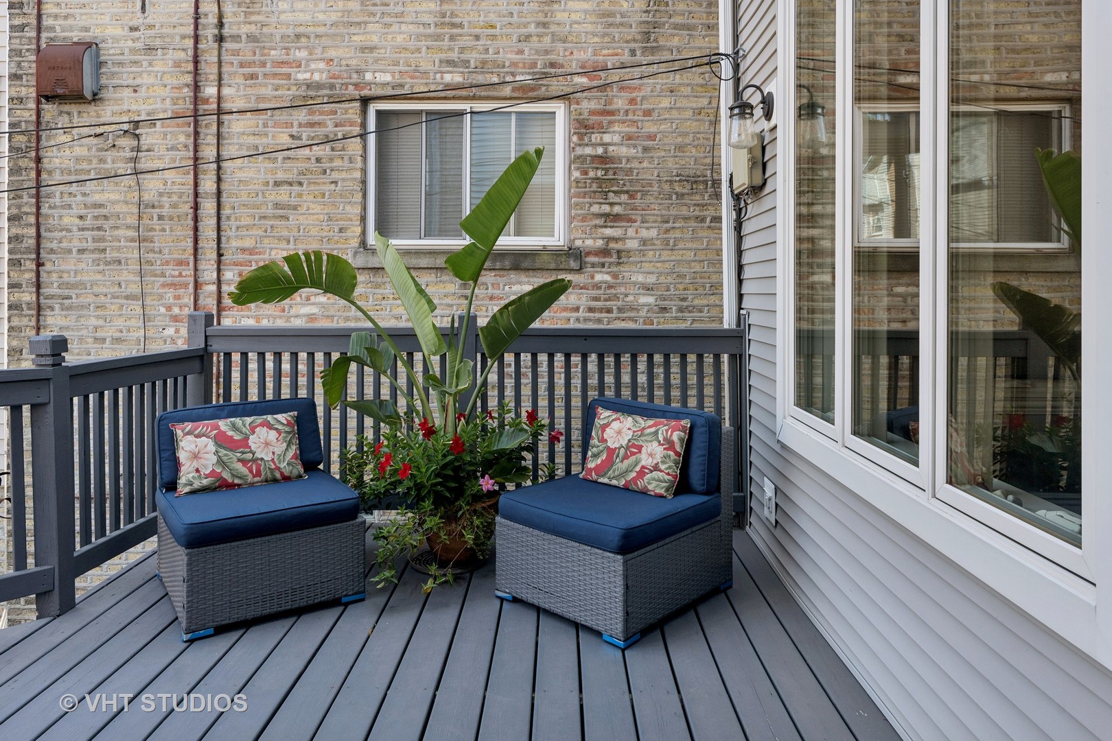 1750 West School Street Chicago, IL 60657 - Photo 8 of 37 a view of a wooden deck with furniture