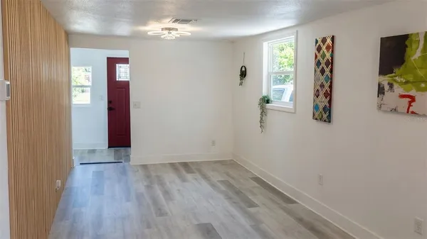a view of livingroom with hardwood floor and a ceiling fan