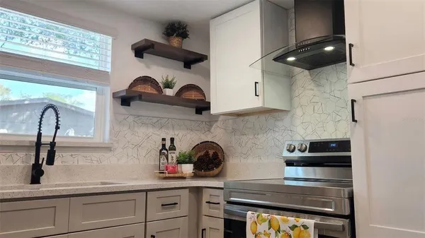 a kitchen with a sink and cabinets