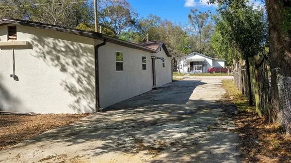 a view of a yard with a tree