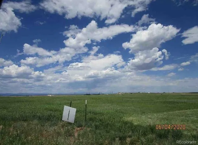 an aerial view of a houses with yard