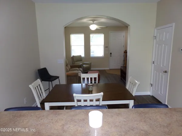 front view of a brick house with a yard