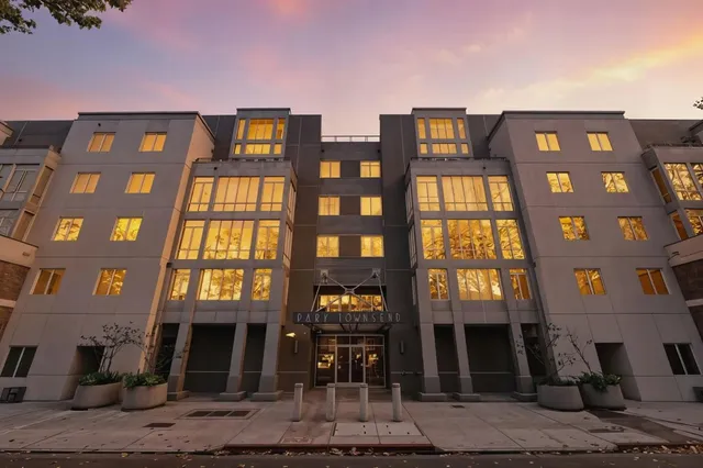 a front view of a multi story residential apartment building