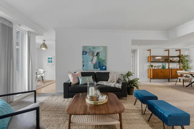a living room with furniture and a table