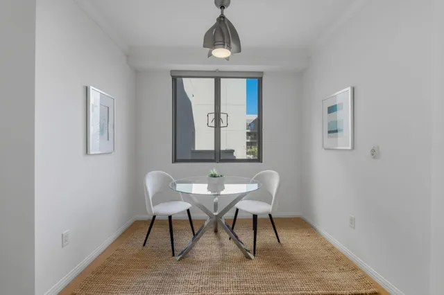 a workspace with wooden floor and a window