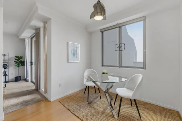 a view of a livingroom with furniture and wooden floor