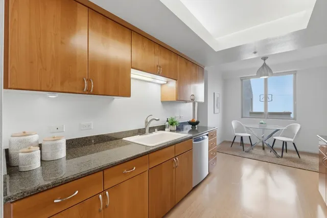 a kitchen with a sink and cabinets