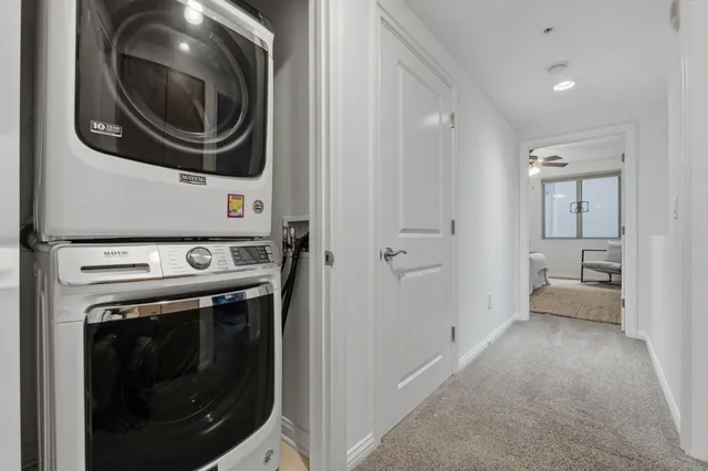 a view of a hallway with washer and dryer