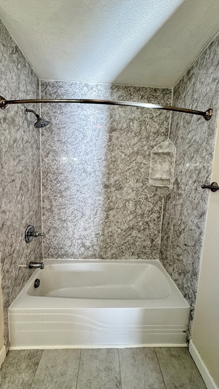 16 Collins Street, Unit 16 Chicopee, MA 01022 - Photo 21 of 31 a bathroom with a bathtub and a shower