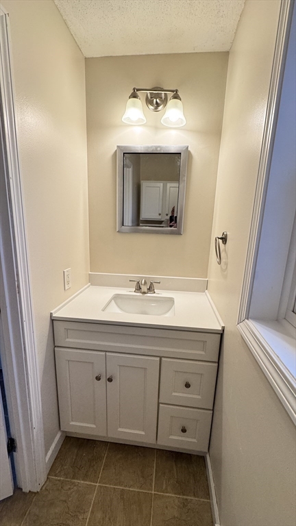 16 Collins Street, Unit 16 Chicopee, MA 01022 - Photo 24 of 31 a bathroom with a sink and a mirror