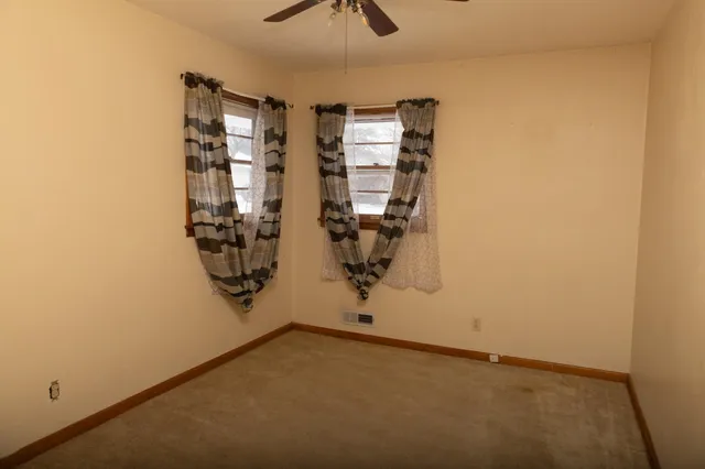 an empty room with windows