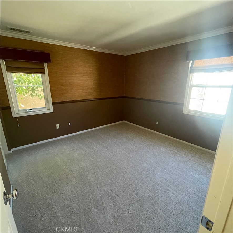 103 Windchime Irvine, CA 92603 - Photo 11 of 16 an empty room with windows