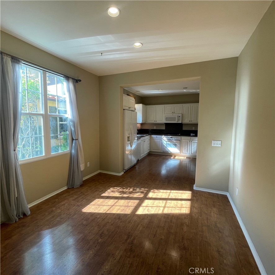 103 Windchime Irvine, CA 92603 - Photo 2 of 16 a view of empty room with wooden floor