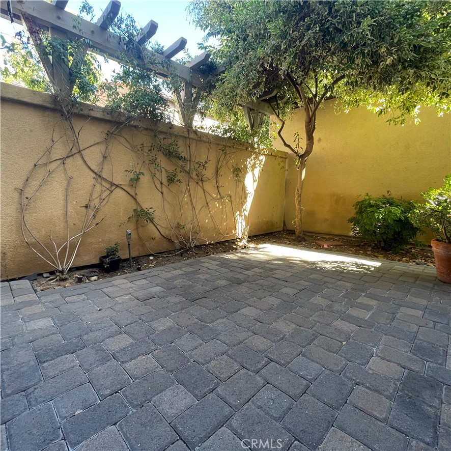 103 Windchime Irvine, CA 92603 - Photo 6 of 16 a view of a yard with a tree
