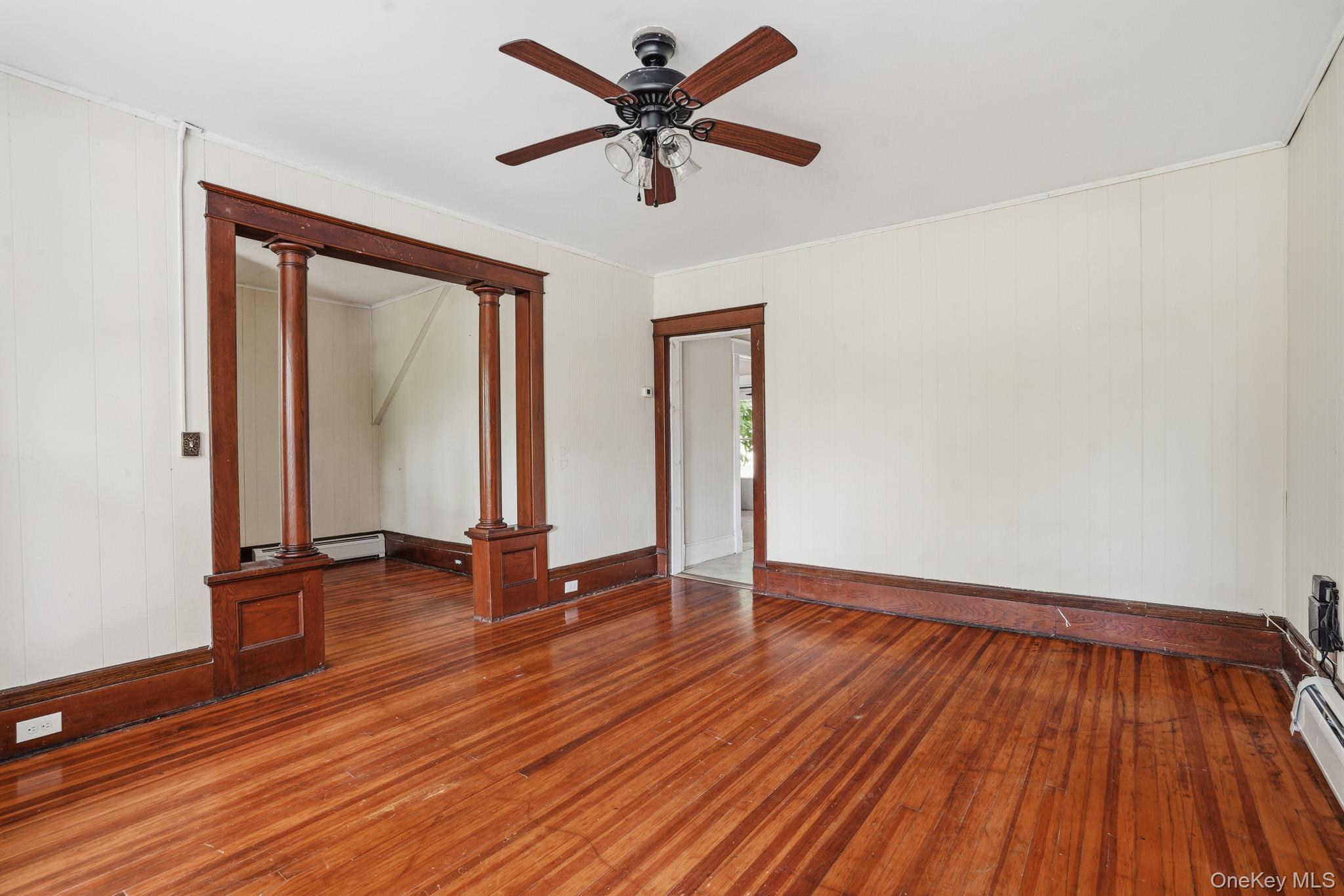65 North Clinton Street Poughkeepsie, NY 12601 - Photo 9 of 43 an empty room with wooden floor and windows