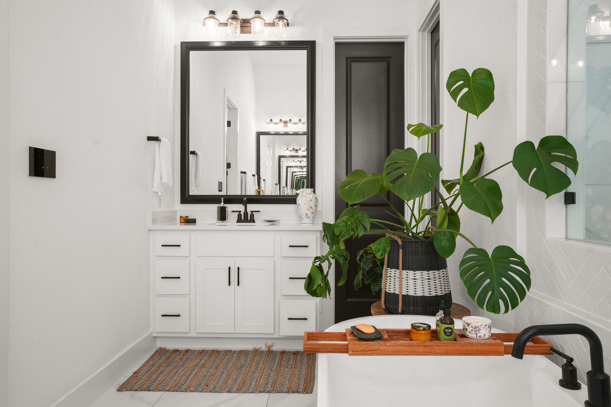 154 LITTLE Strm Cove Austin, TX 78737 - Photo 16 of 37 A freestanding tub and sleek double vanity anchor this modern bathroom oasis with huge walk in shower.