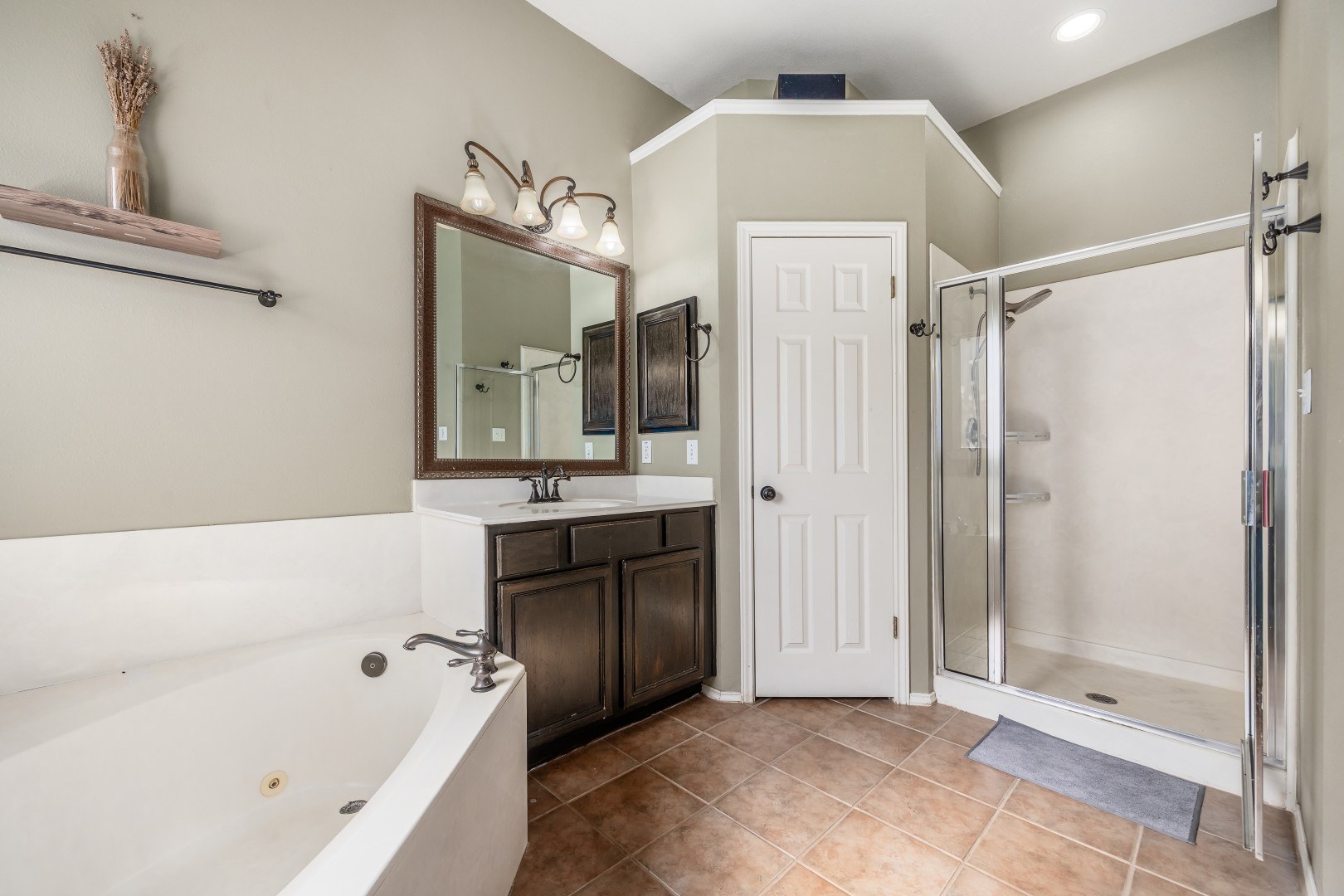 1108 Antelope Ridge Cedar Park, TX 78613 - Photo 11 of 39 High ceilings and tiled flooring complement a separate soaking tub and walk-in shower.