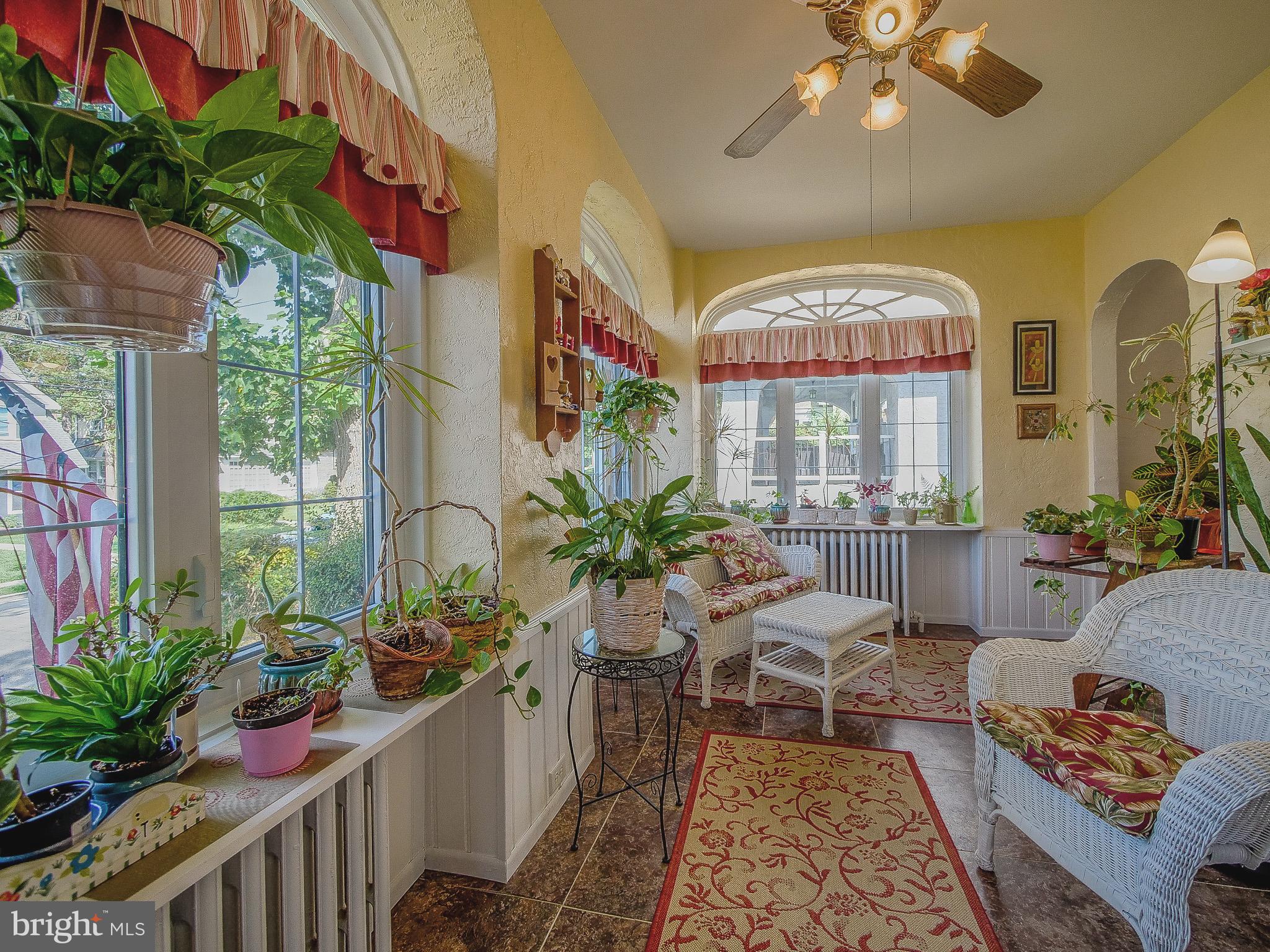 7205 Wayne Avenue Upper Darby, PA 19082 - Photo 30 of 84 a living room with furniture and a chandelier