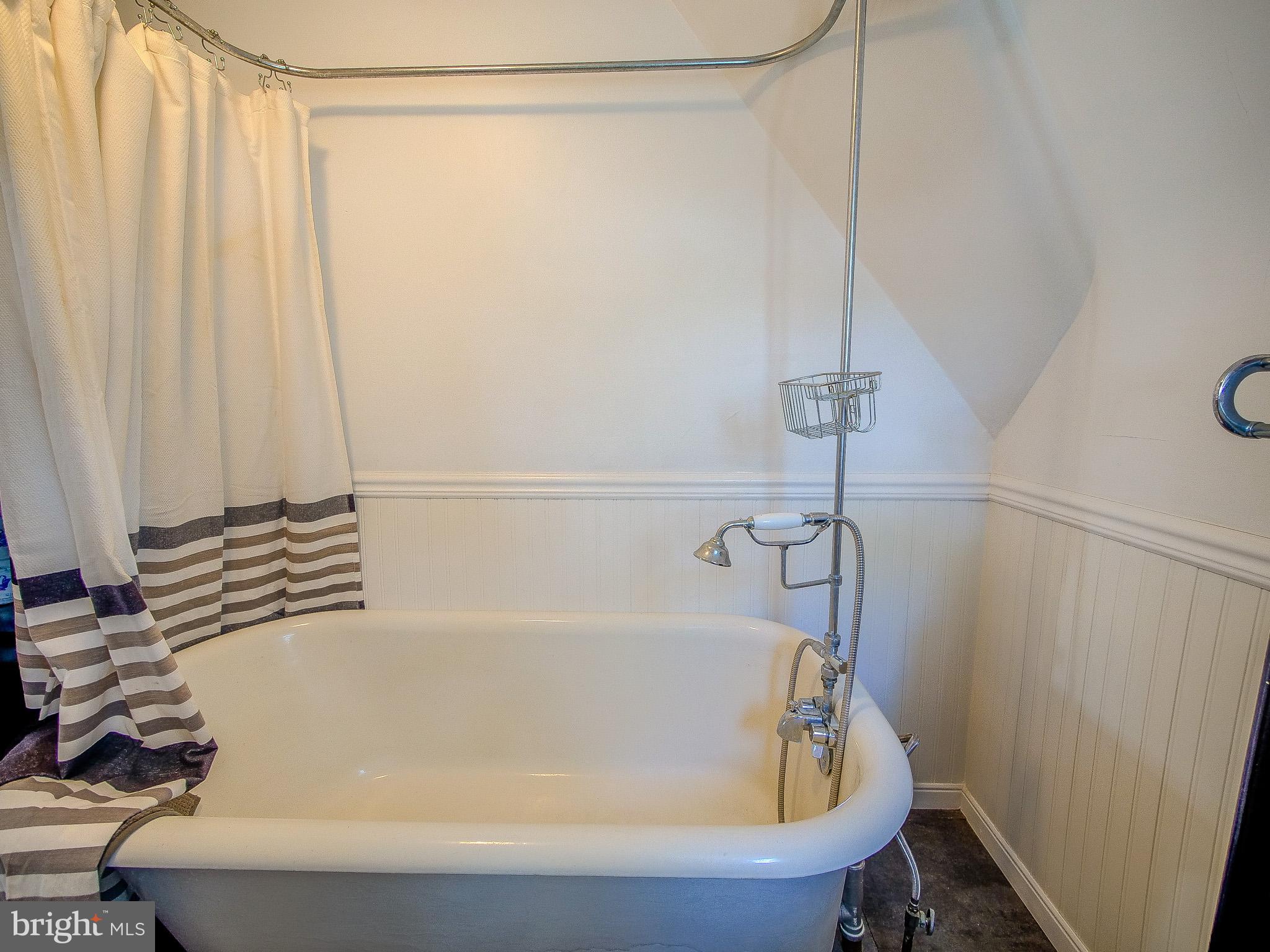 7205 Wayne Avenue Upper Darby, PA 19082 - Photo 70 of 84 a bathroom with a bathtub and a shower