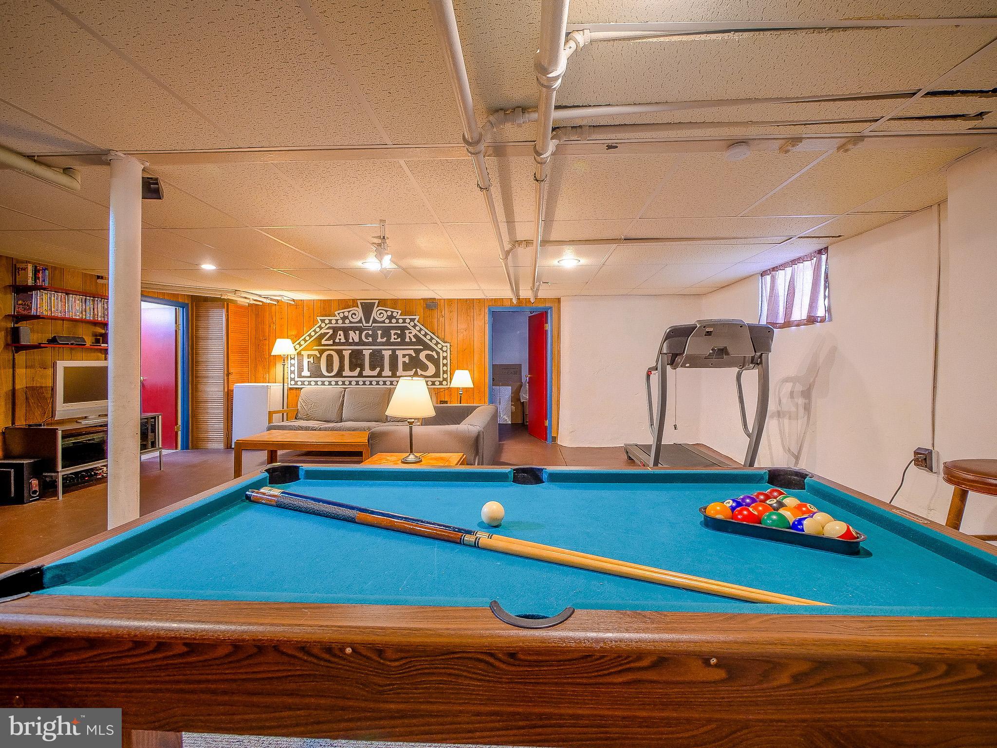 7205 Wayne Avenue Upper Darby, PA 19082 - Photo 75 of 84 a room with lots of white furniture and a wooden floor