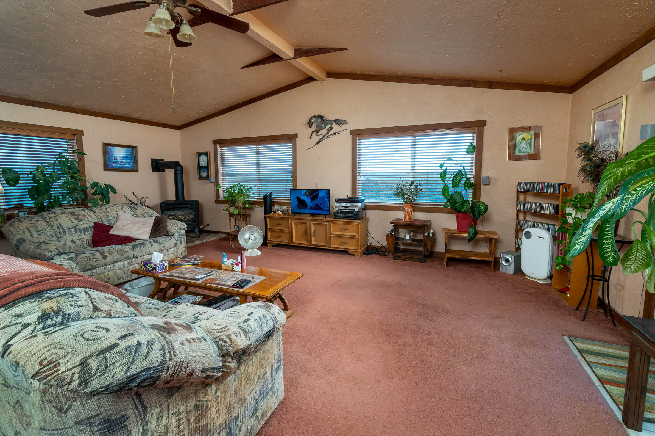 25907 South Cooper Street Bend, OR 97701 - Photo 7 of 34 a living room with furniture and a flat screen tv