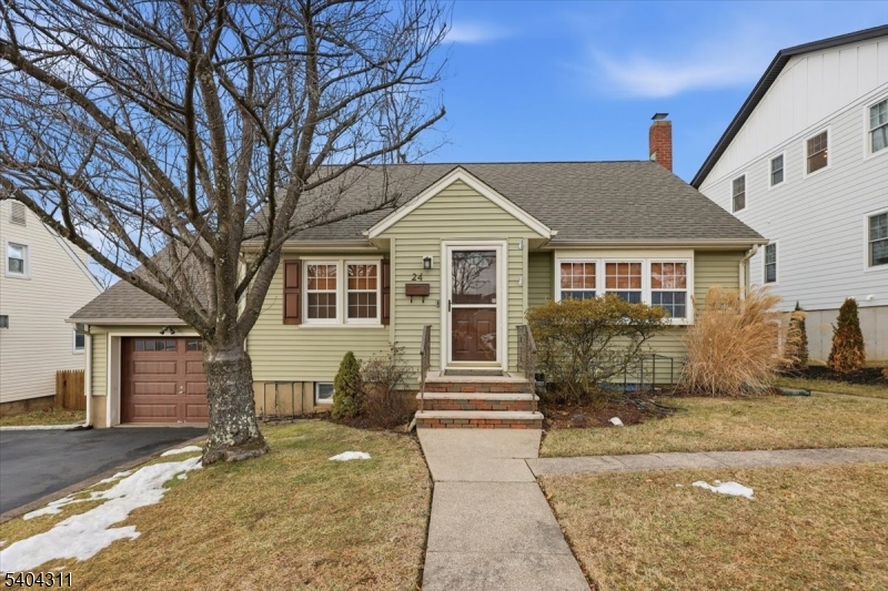 24 Ozone Avenue Cedar Grove, NJ 07009 - Photo 1 of 36 a front view of a house with a yard