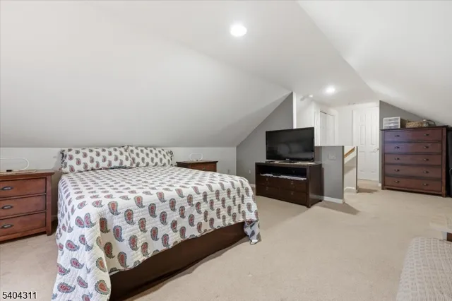 a bedroom with a bed and television